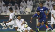 Sadd's Qatari midfielder Salem al-Hajri (L) Sadd's midfielder Boualem Khoukhi (2nd-L) and Hilal's defender Mohammed al-Breik (2nd-R) vie for the ball during the first leg of the AFC Champions League semi-finals football match between Qatar's Al Sadd and S