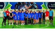 Long jump World Record holder Mike Powell, double-gold medallist at the Worlds, Ashton Eaton, former high jump world champion Stefan Holm and heptathlon double-silver medallist Brianne Theisen-Eaton pose for the students athletes at Doha College during a 
