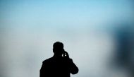 A man talks on his phone at the Mobile World Congress in Barcelona on February 27, 2019. AFP / Pau Barrena