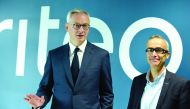 French Finance and Economy Minister Bruno Le Maire (L) and French online advertising company Criteo Co-founder and CEO Jean-Baptiste Rudelle (R) take part in a symposium on the theme 