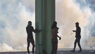 FILE PHOTO: Smoke rises from burning tyres during as Iraqis demonstrate against state corruption, failing public services and unemployment, in the Iraqi capital Baghdad on October 5, 2019.   AFP / AHMAD AL-RUBAYE
