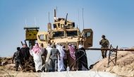 Syrian Kurds take part in a demonstration against Turkish threats at a US-led international coalition base on the outskirts of Ras al-Ain town in Syria's Hasakeh province near the Turkish border on October 6, AFP / Delil SOULEIMAN