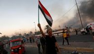 People hold an anti-government protest in Baghdad, Iraq October 5, 2019. Picture taken October 5, 2019. REUTERS/Thaier Al-Sudani