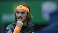 Stefanos Tsitsipas of Greece reacts while playing against Felix Auger-Aliassime of Canada during their second round men's singles match at the Shanghai Masters tennis tournament in Shanghai on October 9, 2019. / AFP / NOEL CELIS