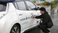 A technician cleans a modified Nissan Leaf driverless car in London, February 27, 2017. Reuters  / Peter Nicholls