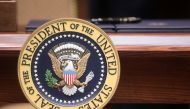 An executive order sits atop a desk adorned with the presidential seal prior to U.S. President Donald Trump signing executive orders on 