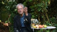 Austrian writer Peter Handke poses in Chaville, in the Paris surburbs, on October 10, 2019 after he was awarded with the 2019 Nobel Literature Prize. AFP / Alain Jocard 