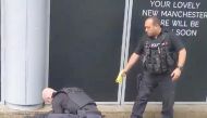 A police officer points a taser while the other holds a man down outside Arndale shopping center, where several people have been stabbed, in Manchester, Britain October 11, 2019 in this still image taken from a social media video. (JOHN GREENHALGH via REU
