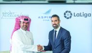 Abdulla Nasser Al Naimi (left), Director General of Aspire Logistics and Fernando Sanz, Director of International Institutional Relations and Director of the LaLiga Ambassadors and Legends Project exchanging documents during the MoU signing ceremony. 