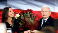 Poland's ruling party Law and Justice (PiS) leader Jaroslaw Kaczynski receives flowers after the exit poll results are announced in Warsaw, Poland, October 13, 2019. REUTERS/Kacper Pempel