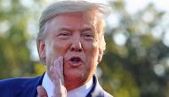 US President Donald Trump speaks to the press after announcing and initial deal with China at the South Lawn of the White House in Washington, DC before departing to Lake Charles, Louisiana to hold a campaign rally on October 11, 2019.  AFP / Nicholas Kam