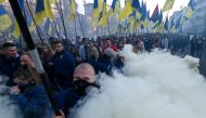 Activists and supporters of nationalist forces march in downtown Kiev on October 14, 2019. AFP / Genya Savilov 
 