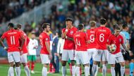 England's players wait on the pitch during temporary interruption of the Euro 2020 Group A football qualification match between Bulgaria and England due to incidents with fans, at the Vasil Levski National Stadium in Sofia on October 14, 2019. AFP / Strin