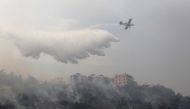 A firefighting aircraft tackles wildfires in Dibbiyeh village, south of Beirut, Lebanon October 15, 2019. REUTERS/Aziz Taher
