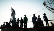 Migrant workers prepare to unload their catch at a port in Samut Sakhon province, Thailand, January 22, 2018. Reuters / Athit Perawongmetha