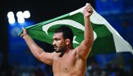 Pakistan’s Inam Muhammad celebrates  after winning the gold  medal in beach wrestling (90kg) at  Katara Beach  on Monday.