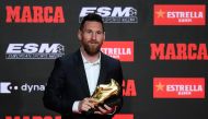 Barcelona's Argentinian forward Lionel Messi poses with his sixth Golden Shoe award after receiving the 2019 European Golden Shoe honoring the year's leading goalscorer during a ceremony at the Antigua Fabrica Estrella Damm in Barcelona on October 16, 201