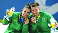 Brazil’s Andre Baran and Rafaella Miller celebrate with their gold medals. (Laurel Photo Services) 