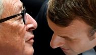 French President Emmanuel Macron talks with European Commission President Jean-Claude Juncker as they attend the second day of the EU leaders summit in Brussels, October 18, 2019. Reuters/Toby Melville 