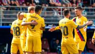 Barcelona's Argentine forward Lionel Messi (L) celebrates after scoring during the Spanish league football match SD Eibar against FC Barcelona at the Ipurua stadium in Eibar on October 19, 2019. / AFP 