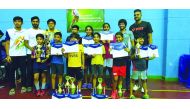 The winners from New Vision Badminton Sports, posing for a group photo along with  the chief coach. Manoj Sahibjan, coach Mohammed Rafi (extreme right) coach Salam and coach Aadharsh (extrme left).