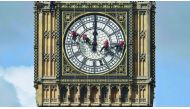 Cleaners abseil down one of the faces of Big Ben to clean and polish the clock face above the Houses of Parliament in central London, August 19, 2014. Reuters / Toby Melville