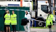 Police is seen at the scene where bodies were discovered in a lorry container, in Grays, Essex, Britain October 23, 2019. Reuters/Hannah McKay
 