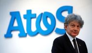 FILE PHOTO: Atos Chairman and CEO Thierry Breton poses in front of the company's logo during a presentation of the new Bull sequana supercomputer in Paris, France, April 12, 2016. REUTERS/Philippe Wojazer