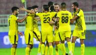 Qatar SC players celebrate a goal against Umm Salal, yesterday. 