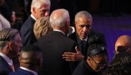 Barack Obama (R) embraces Joe Biden at the conclusion of the funeral service for Rep. Elijah Cummings (D-MD) at New Psalmist Baptist Church on October 25, 2019 in Baltimore, Maryland.  Chip Somodevilla/Getty Images/AFP 