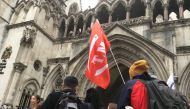 Extinction Rebellion climate change activists gather outside the Royal Courts of Justice in London before a judicial review hearing on a protest ban issued during a series of protests in October, Oct. 24, 2019. Thomson Reuters Foundation/Laurie Goering