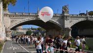 People take part in a peaceful protest march of members of Roman citizens committees, groups and associations that say care about the future of Rome and want to take charge themselves of the Italian capital, on October 26, 2019. AFP / ANDREAS SOLARO