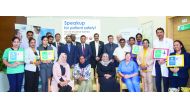 The officials of Aster along with the representatives of Ministry of Public Health Qatar pose for a group photo.