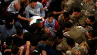 Lebanese army soldiers confront demonstrators in an attempt to open a road blocked by them during ongoing anti-government protests in the port city of Sidon, Lebanon October 28, 2019. REUTERS/Ali Hashisho