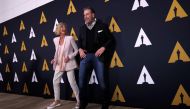 FILE PHOTO: Cast members John Travolta and Olivia Newton-John dance at a 40th-anniversary screening of 