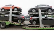 FILE PHOTO: Cars made by GM Korea are seen on trucks in a yard of GM Korea Bupyeong plant before they are transported to a port for export in Incheon, west of Seoul, August 9, 2013. Reuters / Lee Jae-Won