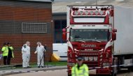 Police are seen at the scene where bodies were discovered in a lorry container, in Grays, Essex, Britain October 23, 2019. Reuters/Hannah McKay