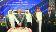 Minister of Justice and Acting Minister of the State for Cabinet Affairs, H E Dr. Issa bin Saad Al Jafali A Nuaimi (centre) and Minister of Education and Higher Education, H E Dr. Mohammed Abdul Wahed Al Hammadi (left) cutting the cake with Kim Chang-mo, 