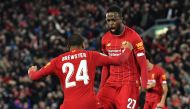 Liverpool's Belgium striker Divock Origi celebrates scoring his team's fourth goal with Liverpool's English striker Rhian Brewster during the English League Cup fourth round football match between Liverpool and Arsenal at Anfield in Liverpool, north west 