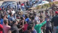 Lebanese army soldiers clash with protesters as they attempt to reopen the main highway that links the cities of Saida and Beirut near the town of Jiyeh, south of the Lebanese capital Beirut, on October 30, 2019. AFP