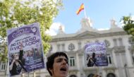 Women gather outside the Supreme Court after Spain's top court found five men known as the 