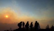 Firefighters monitor the Kincade Fire on October 29, 2019 in Healdsburg, California. Justin Sullivan/Getty Images/AFP