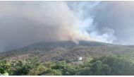 Ash and smoke rises after a volcano eruption started forest fires in Stromboli, Italy, July 3, 2019 in this still image obtained from video. Gernot Werner Gruber via Reuters