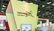 The officials posing for a group picture on the sidelines of QITCOM.