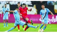 Al Duhail and Al Sadd players in action during their match at Al Duhail Stadium on Saturday. 