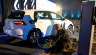 A member of staff charges a Volkswagen e-Golf electric car during its launch for use in its ride-hailing service in Kigali, Rwanda October 29, 2019. REUTERS/Jean Bizimana