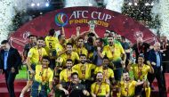 Al Ahed's players and coaching staff celebrate with the trophy after winning the 2019 AFC Cup Final between North Korea's April 25 Sports Club and Lebanon's Al Ahed FC at Kuala Lumpur Stadium in Kuala Lumpur on November 4, 2019. / AFP / Mohd RASFAN