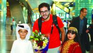 World No. 4 and former world champion Karim Abdel Gawad being welcomed by Qatari children at the Hamad International Airport yesterday.

