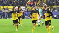 Dortmund's Moroccan defender Achraf Hakimi (C) celebrate scoring the 3-2 goal with his team-mates in the second half of the UEFA Champions League Group F football match BVB Borussia Dortmund v Inter Milan in Dortmund, western Germany, on November 5, 2019.