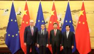 (L-R) European Commissioner Phil Hogan, French President Emmanuel Macron, Chinese President Xi Jinping and China's Commerce Minister Zhong Shan pose at the Great Hall of the People in Beijing on November 6, 2019. AFP / Ludovic MARIN